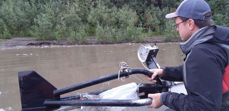 researcher in boat on a lake