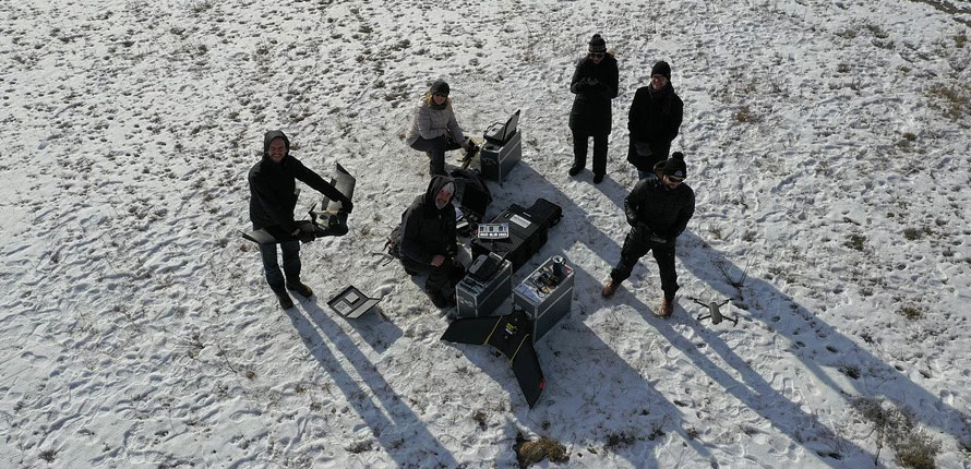 Researchers on snow from above