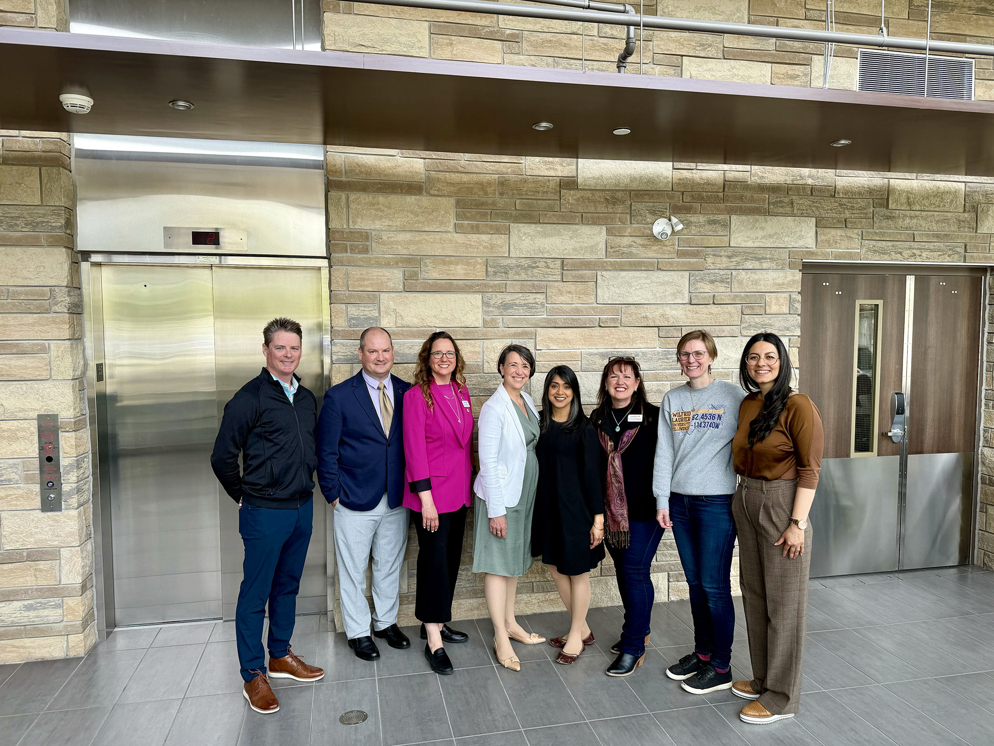 Group photo from a government visit to Laurier